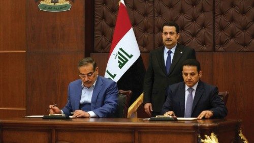 Iraqi Prime Minister Mohammed Shia al-Sudani looks on as Iraq's National Security Adviser Qasim ...