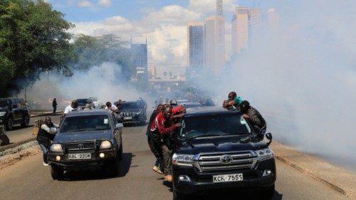 Riot police fire teargas to disperse supporters of Kenya's opposition leader Raila Odinga of the ...