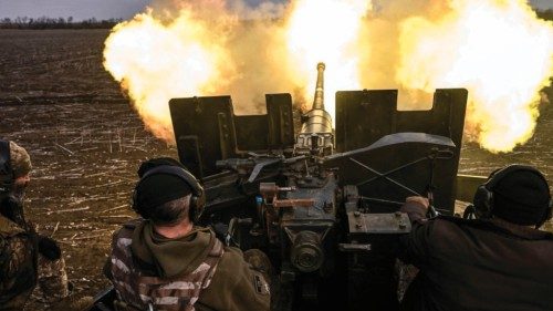 Ukrainian servicemen fire with an anti-aircraft gun at Russian positions near Bakhmut on March 20, ...