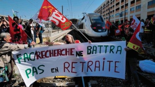 People demonstrate against the law reforming the pensions system at Nice's railway station, ...