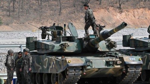 A South Korean soldier stands on a South Korean K1A1 tank before a Warrior Shield live fire exercise ...