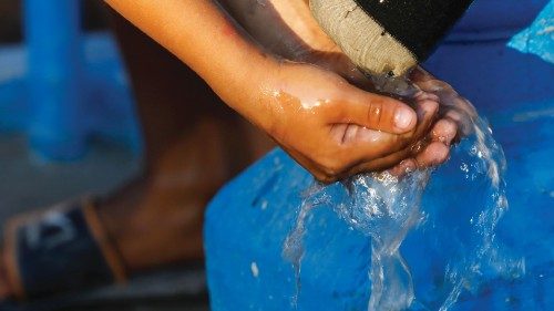 epa10536021 A child washes hands with water from a pump well in a community of Taguig City, Metro ...