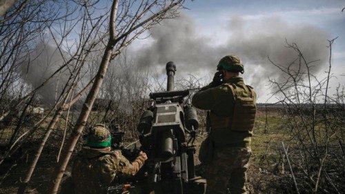 Ukrainian servicemen fire with an M119 105mm howtitzer at Russian positions near Bachmut, on March ...