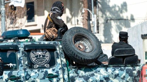 Taliban security personnel sit in a vehicle near the site of a suicide attack in Kabul on March 27, ...