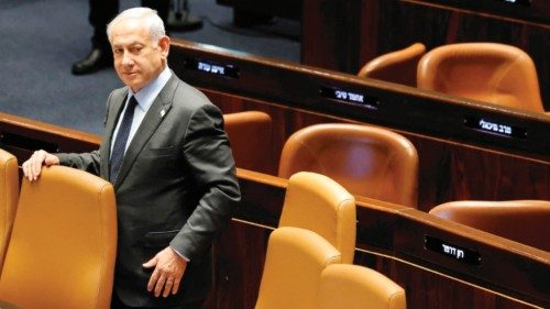 Israeli Prime Minister Benjamin Netanyahu stands at the Knesset, Israel's parliament in Jerusalem, ...