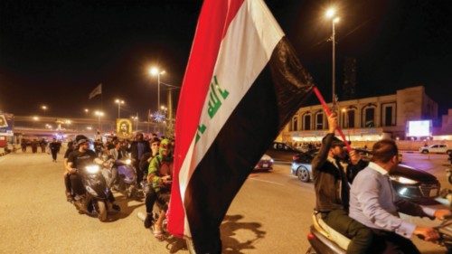 Iraqi protesters demonstrate against Iraq's parliament after it approved amendments to the elections ...