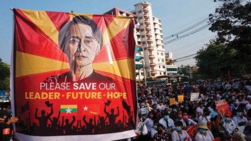 st(FILES) In this file photo taken on February 15, 2021 a banner featuring Aung San Suu Kyi is ...