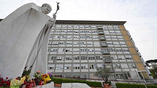 A view shows a statue of late Pope John Paul II at the main entrance of Gemelli hospital on March ...