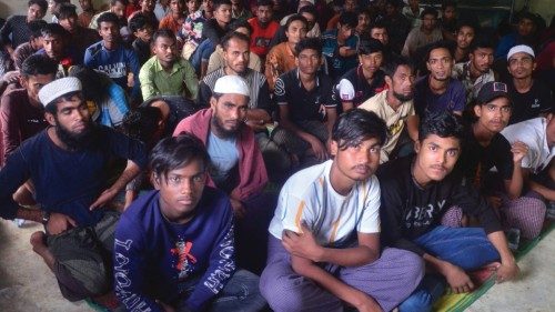 Rohingya refugees sit inside a temporary shelter after they landed in Kuala Matang Peulawi, East ...