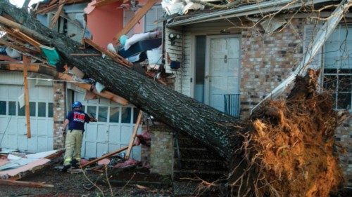 LITTLE ROCK, AR - MARCH 31: A firefighter checks homes for injured residents in the Walnut Ridge ...