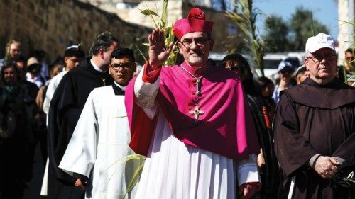 Latin Patriarch of Jerusalem Pierbattista Pizzaballa gestures as he leads a Palm Sunday procession ...