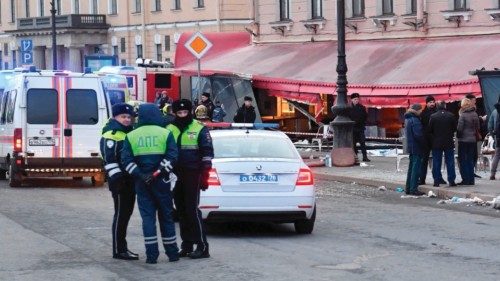 Russian police investigators inspect a damaged 'Street bar' cafe in a blast in Saint Petersburg on ...