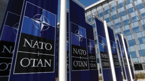 FILE PHOTO: Banners displaying the NATO logo are placed at the entrance of new NATO headquarters ...