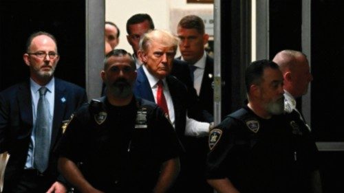 TOPSHOT - Former US President Donald Trump makes his way inside the Manhattan Criminal Courthouse in ...