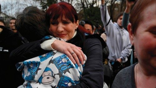Inessa hugs her son Vitaly after the bus delivering him and more than a dozen other children back ...
