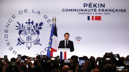 French President Emmanuel Macron delivers a speech as he meets the French community in Beijing, ...