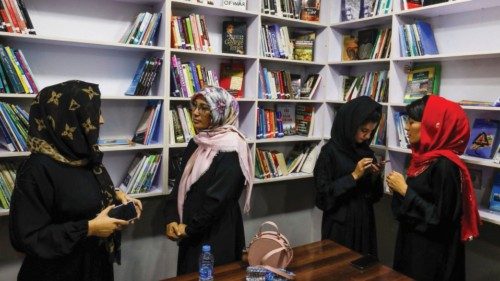 FILE PHOTO: Afghan women attend the inauguration of women's library in Kabul, Afghanistan, August ...