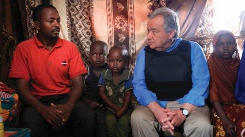 UN secretary general Antonio Guterres (R) sits with a displaced family as he visits an Internal ...