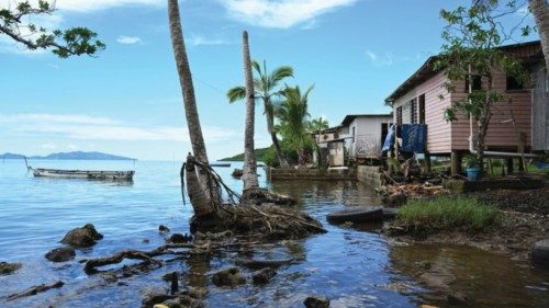 epa10362825 Houses impacted by rising sea levels are seen during the Fijian election campaign in the ...