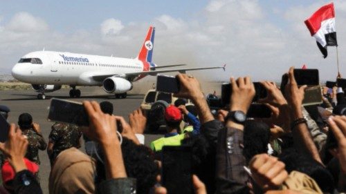 Relatives react as International Committee of the Red Cross (ICRC)-chartered plane lands carrying ...