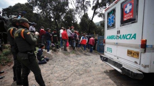 Emergency teams and police guard the outskirts of the 'El Roble' mine in Cucunubá, Colombia, ...