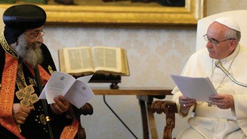 Pope Francis (R) listens to the Coptic Orthodox leader Tawadros II during a private audience in the ...
