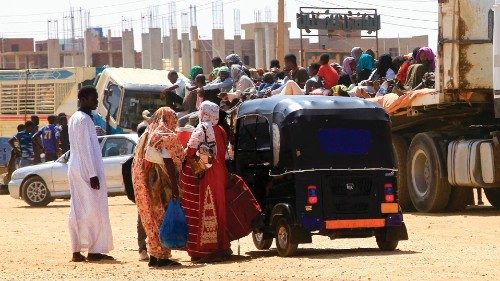 People flee the southern part of Khartoum as street battles between the forces of two rival Sudanese ...