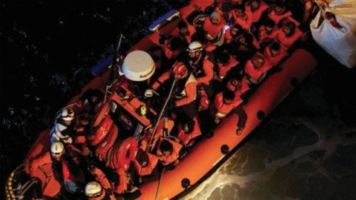 FILE PHOTO: Migrants are brought to the Geo Barents rescue ship, operated by Medecins Sans ...