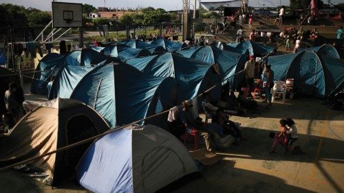 FILE PHOTO: Venezuelan migrants are seen inside a coliseum where a temporary camp has been set up, ...