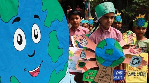 Students dressed with environmental themed designs take part in an event on the occasion of 'Earth ...