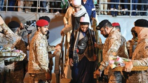 Members of the Saudi Navy personnel assist civilians, evacuated by Saudi Arabia from Sudan to escape ...