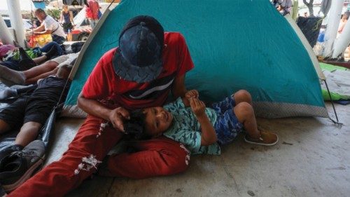 Migrants, detained for months in southern Mexico, rest during a pause amid their trip in a caravan ...