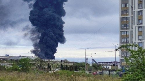 Smoke rises over a fuel tank following an alleged drone attack in Sevastopol, Crimea, April 29, ...