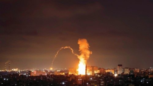 Smoke rises above buildings in Gaza City on the Palestinian enclave on May 3, 2023. e - The Israeli ...