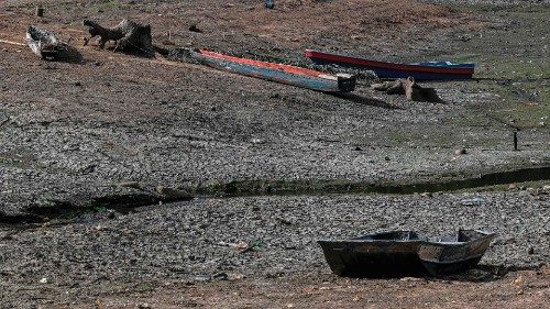 Aerial view showing boats stranded in the dried bed of Alhajuela Lake during the summer drought, in ...