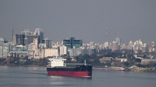 FILE PHOTO: A cargo grain ship sails through the waters of the Parana River, in Rosario, Argentina ...