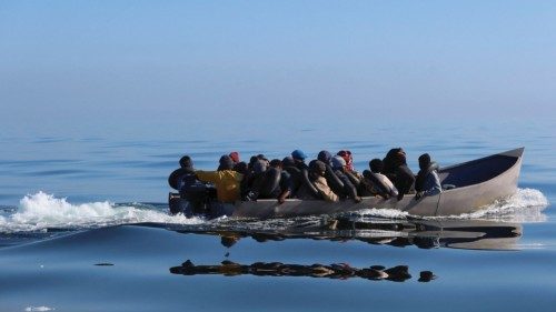 Migrants navigate on a metal boat as they are spotted by Tunisian coast guards at sea during their ...