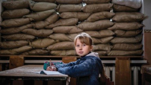 Lera Nagormay, 10, sits for a photograph in a classroom at school in Marinka, Donetsk Oblast, ...