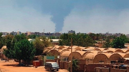 Smoke billows in Khartoum amid ongoing fighting between the forces of two rival generals in Sudan, ...