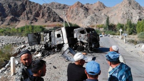 (FILES) In this file photo taken on September 20, 2022 a burned-out truck sits on a road near the ...