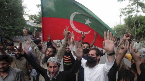 Supporters of Pakistan's former Prime Minister Imran Khan celebrate, as according to Khan's lawyer ...