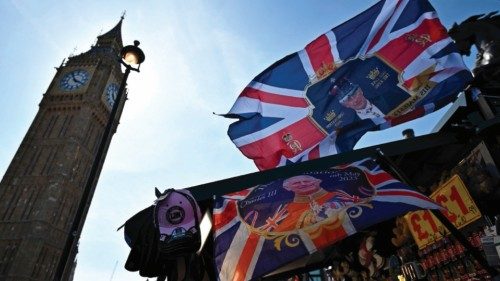 TOPSHOT - A Coronation-themed Union flag is pictured at a souvenir stall near the Elizabeth Tower, ...