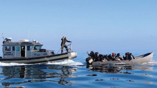 FILE PHOTO: Tunisian coast guards try to stop migrants at sea during their attempt to cross to ...