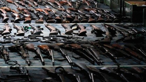 Weapons confiscated in the latest government disarmament action are displayed at a police depot near ...