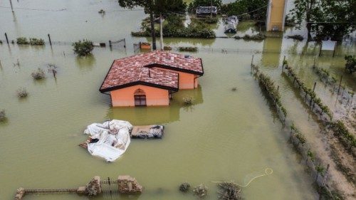 An aerial view taken on May 18, 2023 shows a flooded house in the town of Cesena, after heavy rains ...