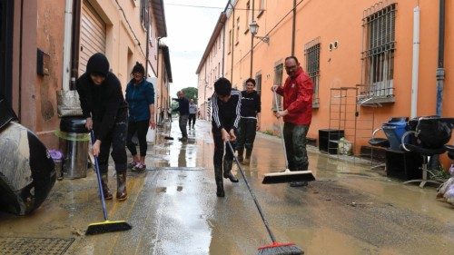 People clean up after heavy rains hit Italy's Emilia Romagna region, in Castel Bolognese, Italy, May ...