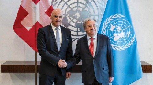 epa10647864 Swiss Federal President Alain Berset (L) shakes hands with UN Secretary General Antonio ...