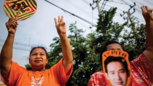 Protesters flash three finger salutes outside the Thai Parliament in Bangkok on May 23, 2023 during ...