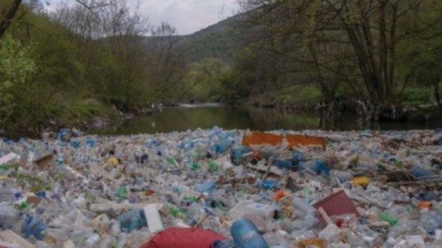 Dumped plastic bottles and other garbage float along the Morava river in the village of Pogragje ...
