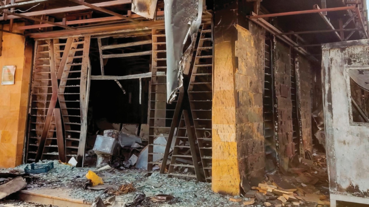 A burnt-down branch of a bank is pictured in southern Khartoum on May 24, 2023. Sporadic artillery ...